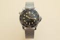 Omega 007 sin guante fondo crema